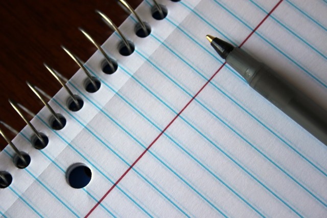 spiral notebook and pen