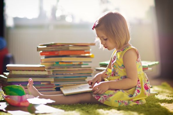 young girl reading book