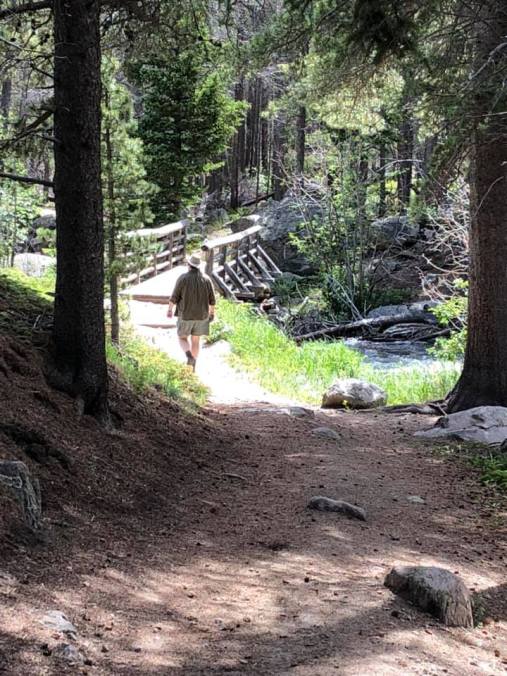 Troy walking ahead on trail day 2 hiking July 2019