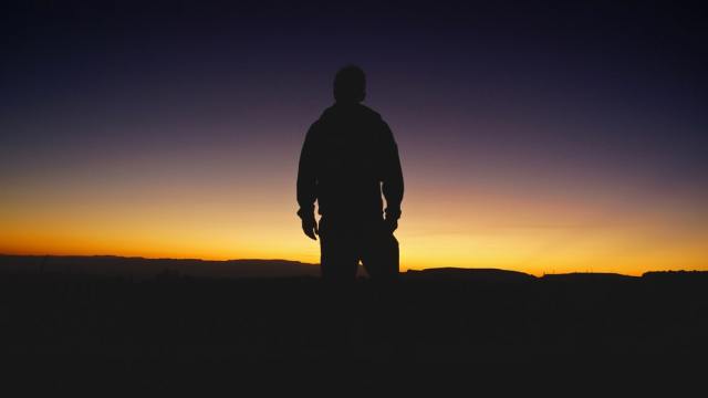 depressed man in sunset