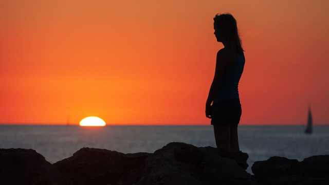 woman in sunset sad