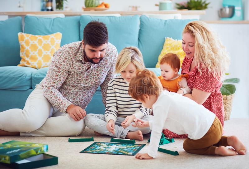 family playing board game