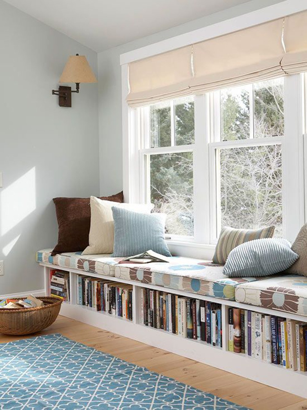 window seat with books and pillows