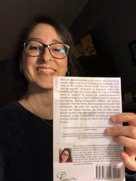 Me showing the back of my book PofP April 1 2020